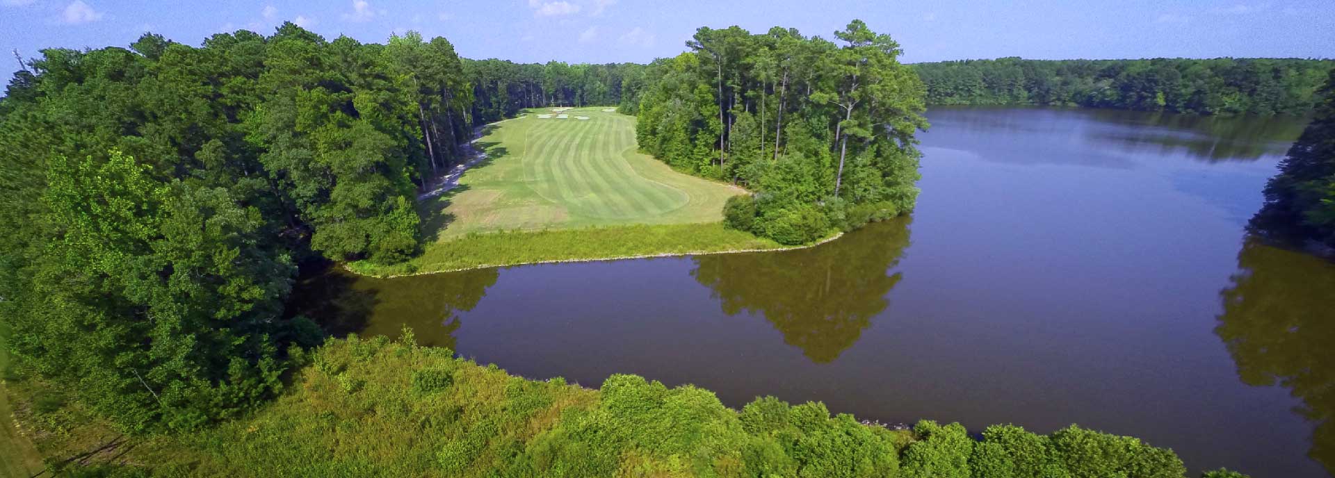 Pond of golf course with trees