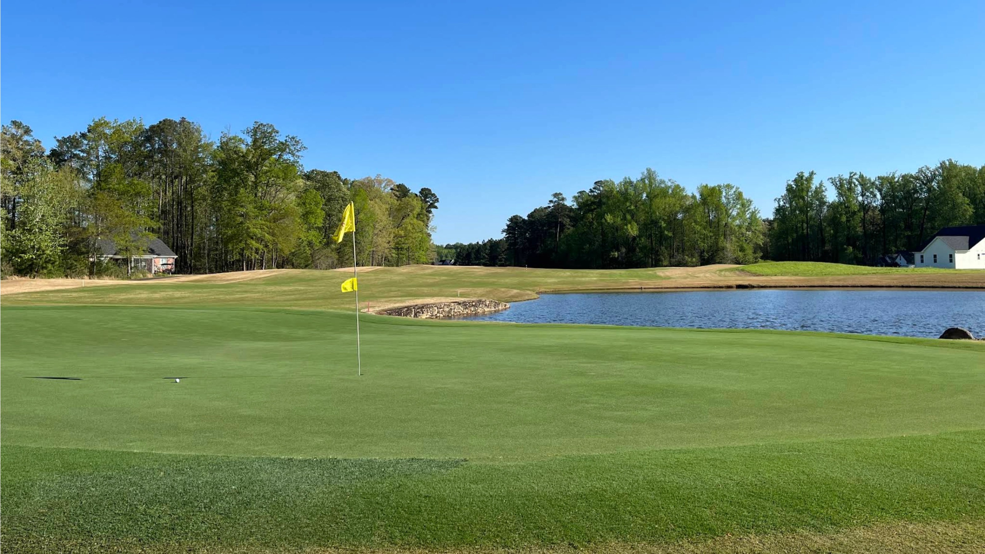 Putting green with flagstick at Belmont Lake Golf Club